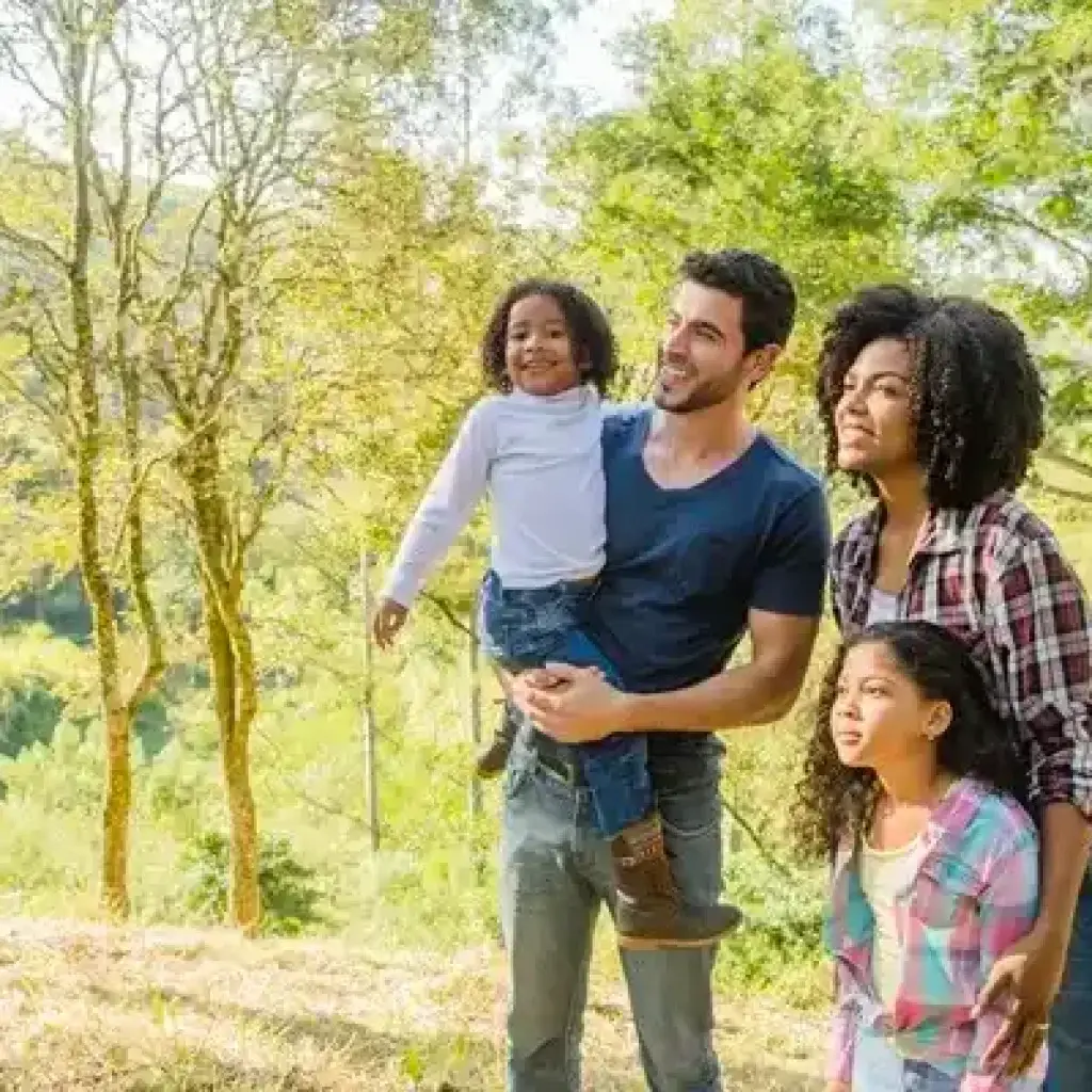 Smiling family enjoying a scenic holiday in Kerala with kids