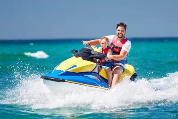 Smiling family enjoying their Andaman holiday with island visits to Havelock, Neil, and Port Blair – ideal 6-day trip for all age groups.